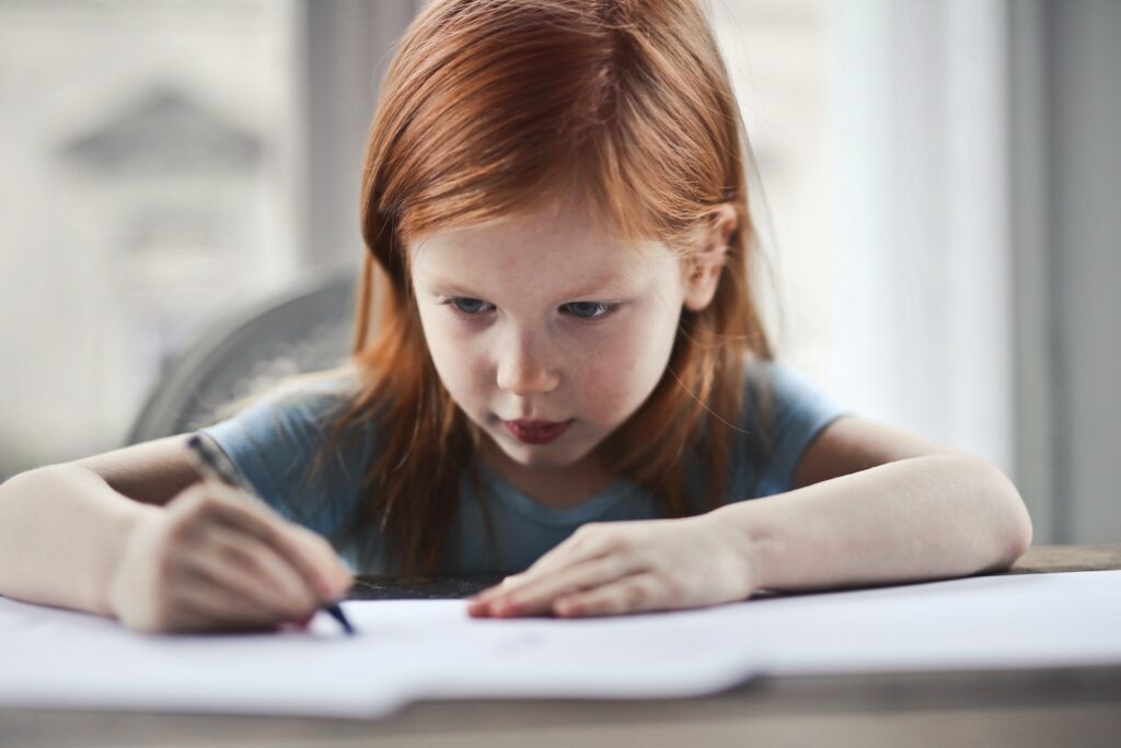 Girl Writing on Paper